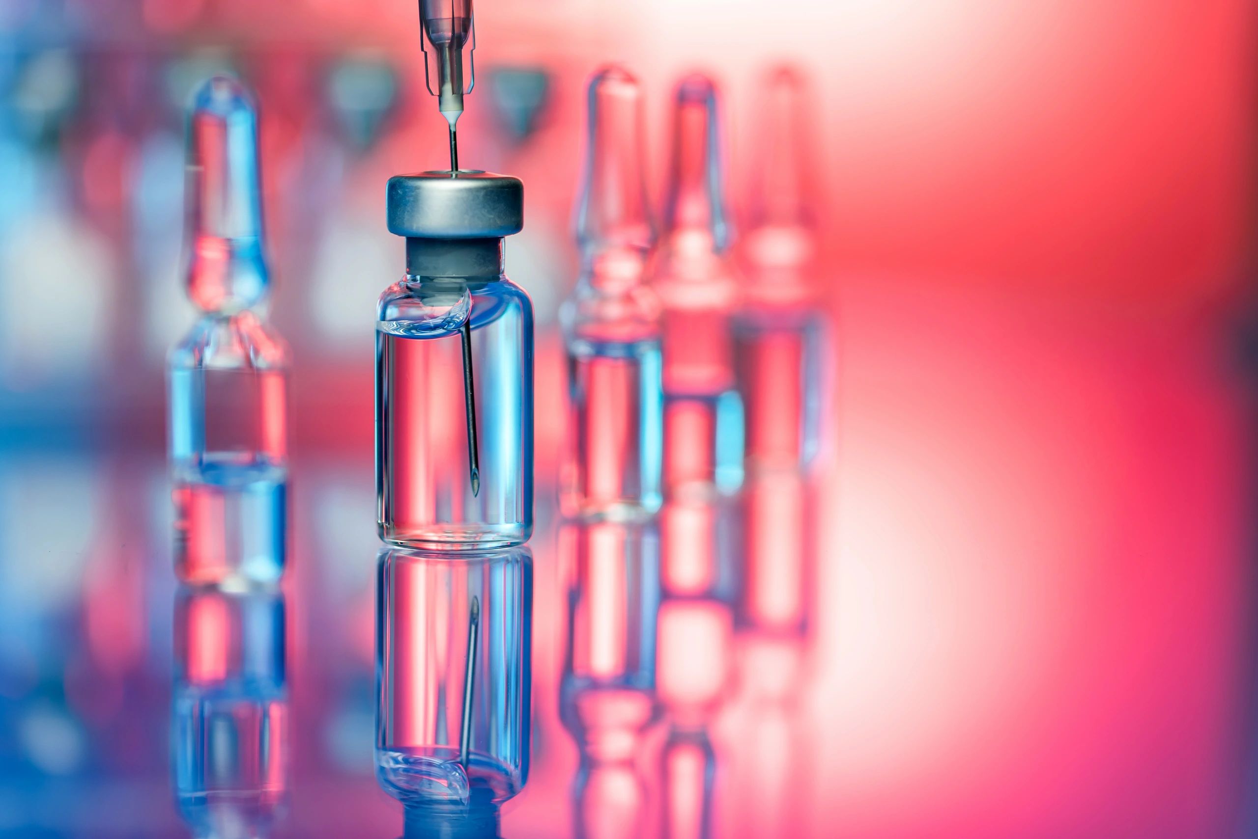Vaccine vial and syringe in a clinical setting