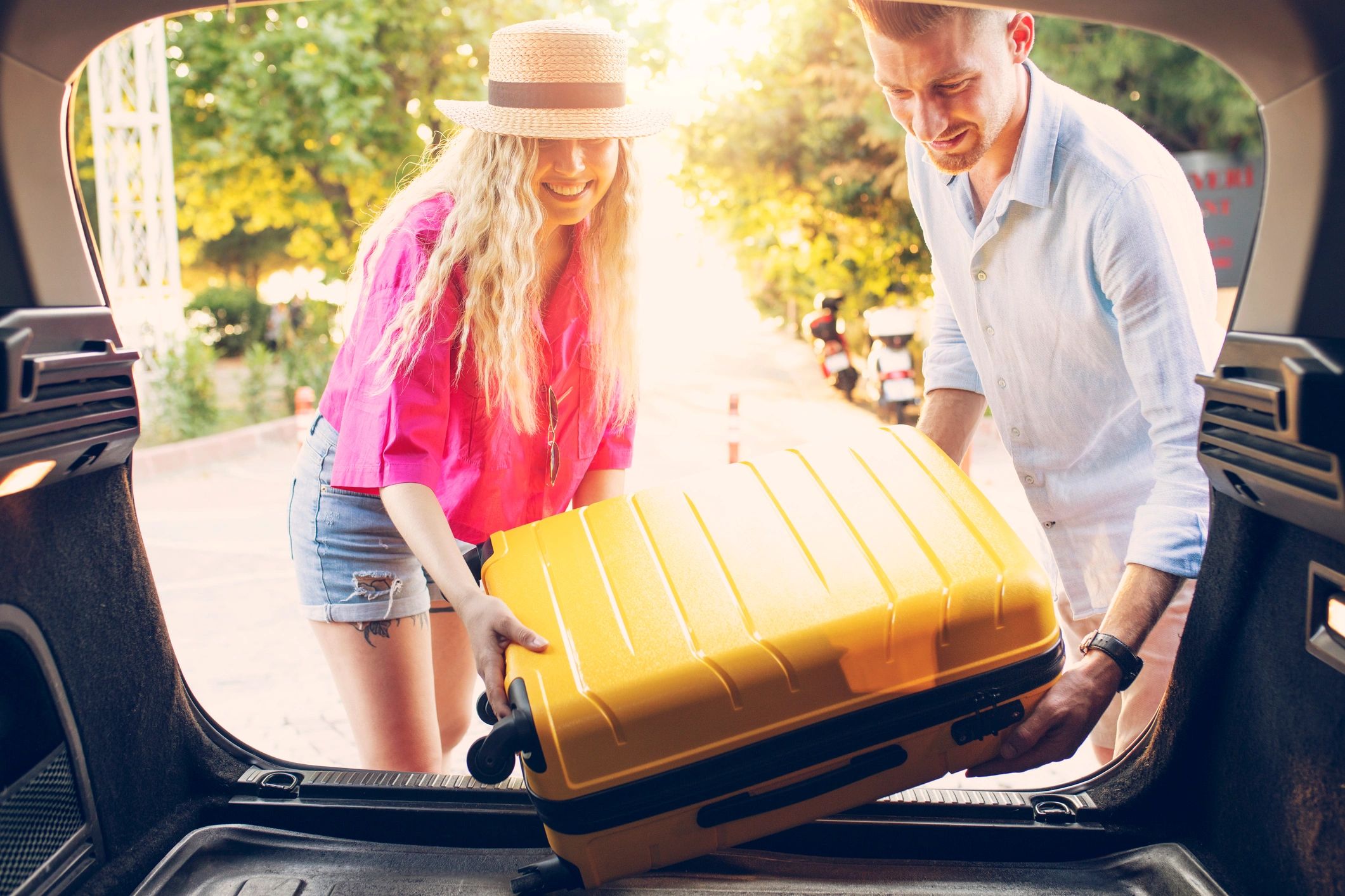 Couple preparing luggage for a trip