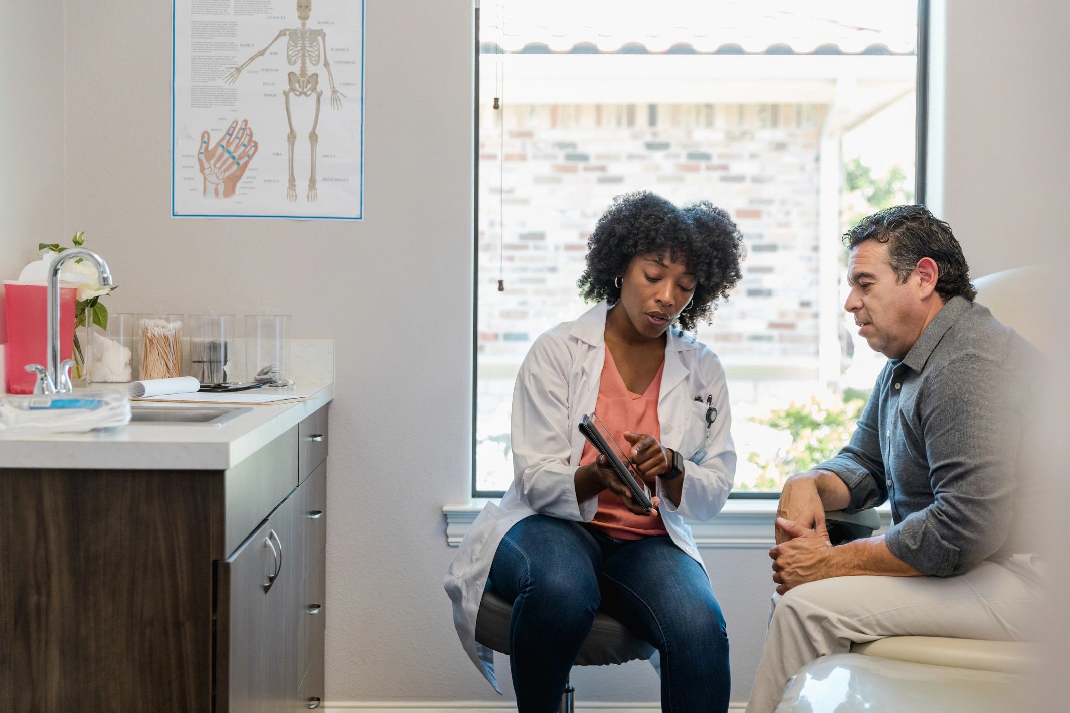 Clinician reviewing travel health information with a patient