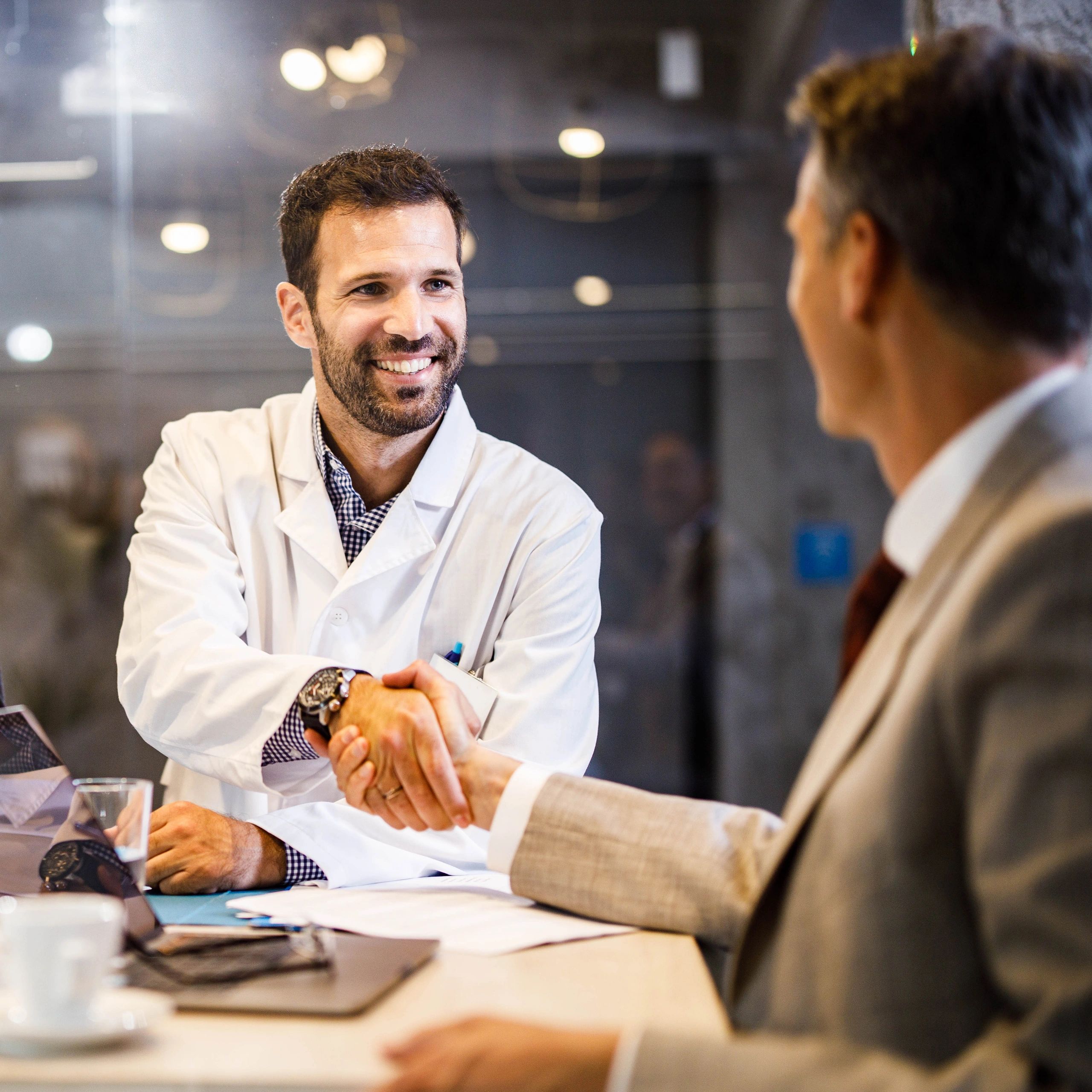 Doctor shaking hands with a patient