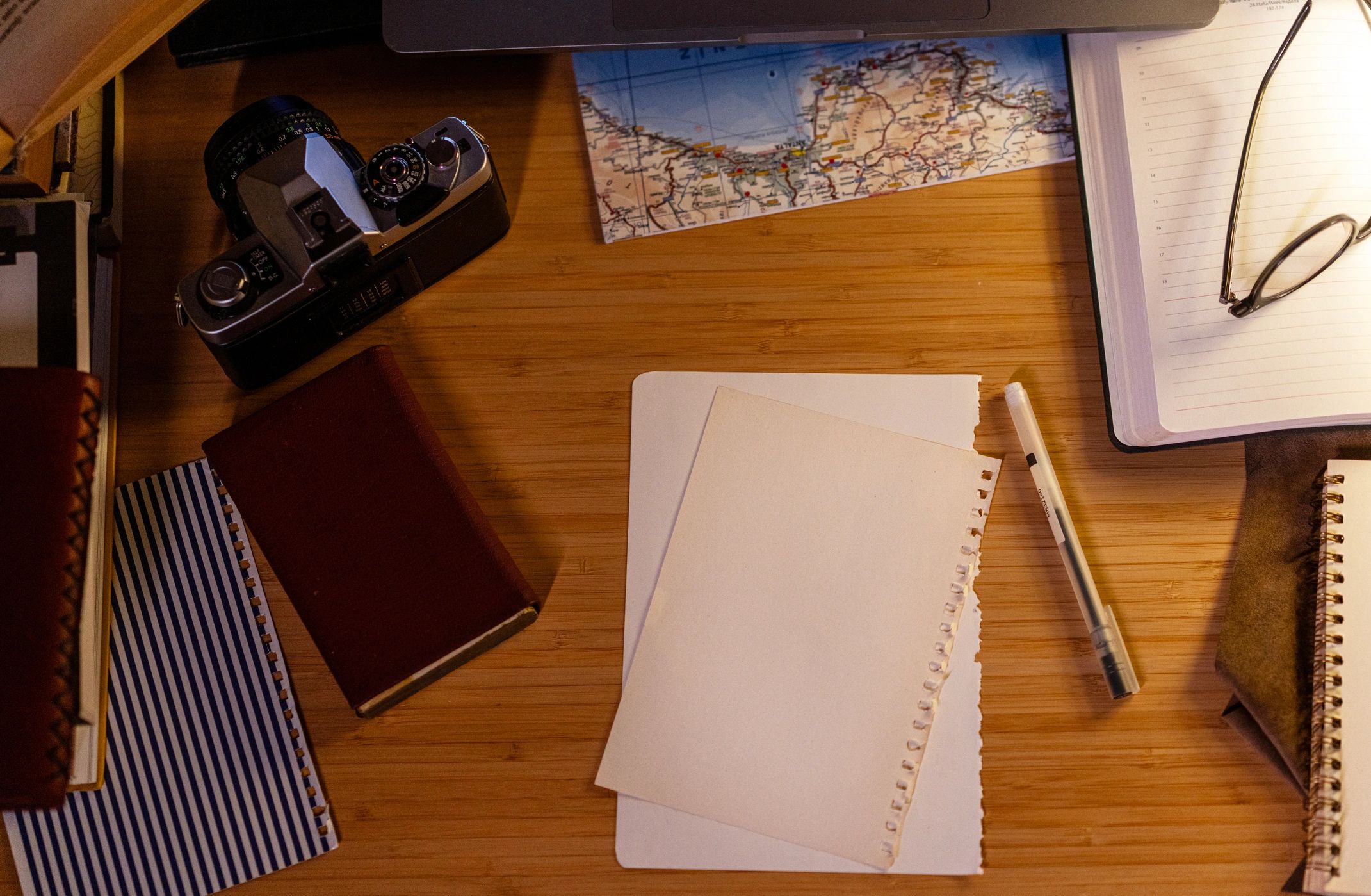 Travel planning desk with map and essentials